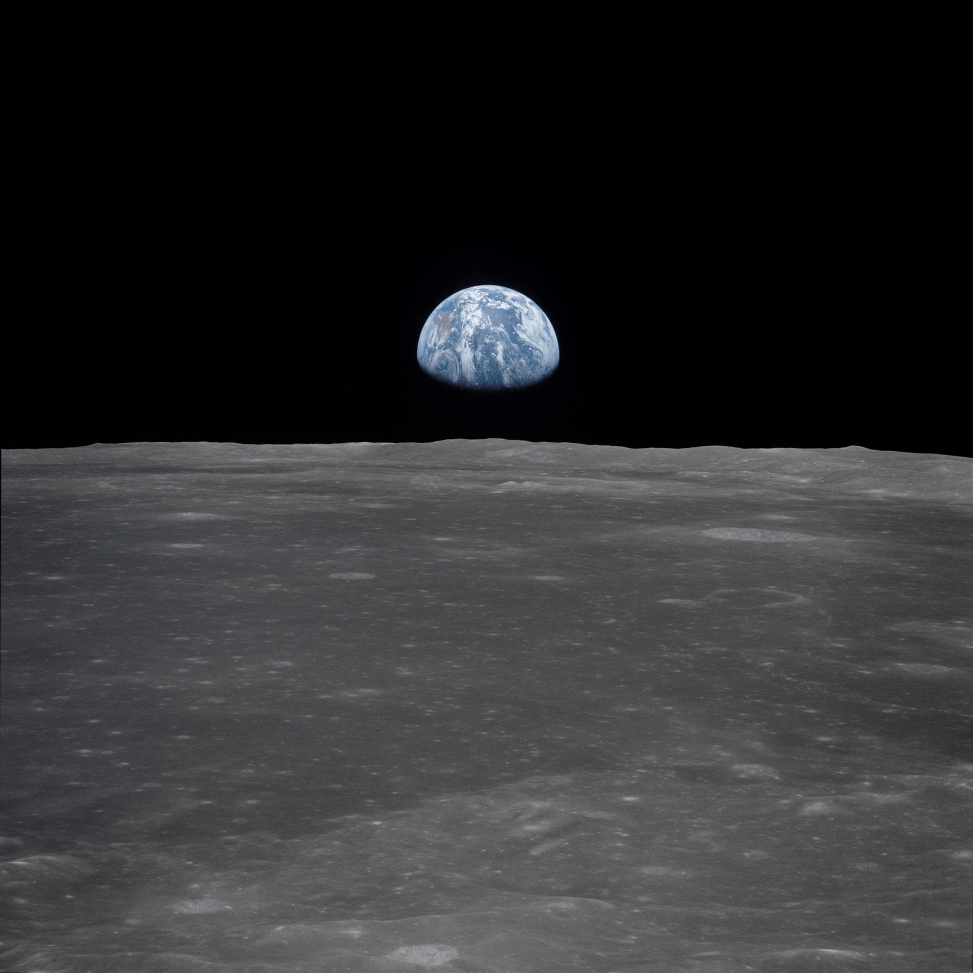 Earth above the lunar horizon, photographed during Apollo 11.